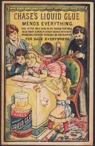 Chase's Liquid Glue Victorian Trade Card, family with scrapbook project at table.